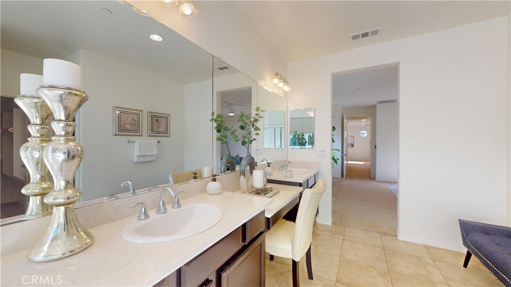 28620 Vista Del Rio Drive Valencia, CA 91354 - Photo 32 of 40 a dining room with a table and chairs