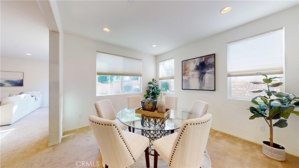 28620 Vista Del Rio Drive Valencia, CA 91354 - Photo 7 of 40 a dining room with furniture and potted plant