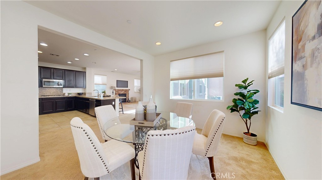 28620 Vista Del Rio Drive Valencia, CA 91354 - Photo 8 of 40 a dining room with furniture and a potted plant