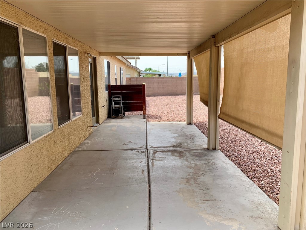 3821 Bombastic Court Las Vegas, NV 89147 - Photo 33 of 36 This spacious patio offers an inviting outdoor retreat with ample room for relaxation and entertaining.