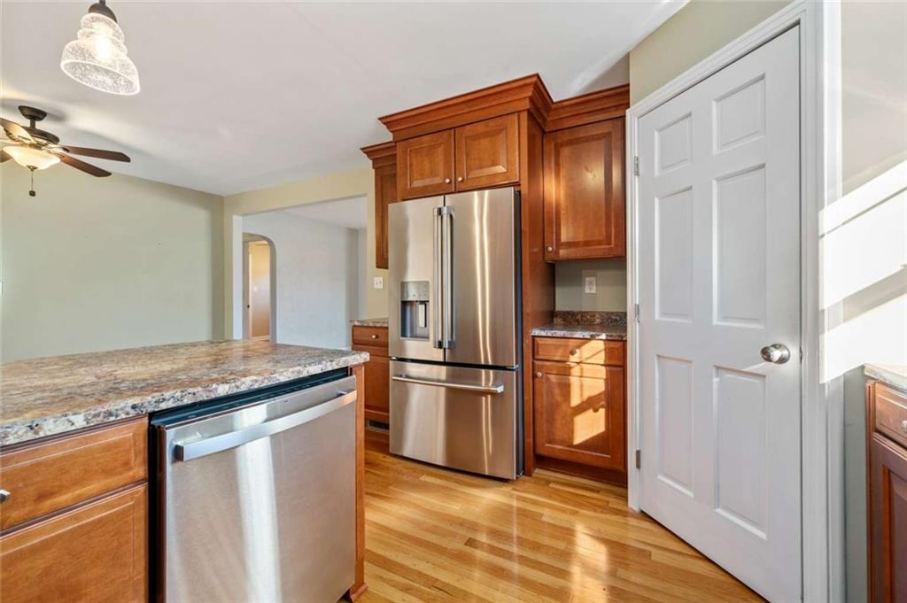 9767 Bellcrest Road Pittsburgh, PA 15237 - Photo 14 of 25 a kitchen with stainless steel appliances granite countertop a refrigerator and a stove top oven