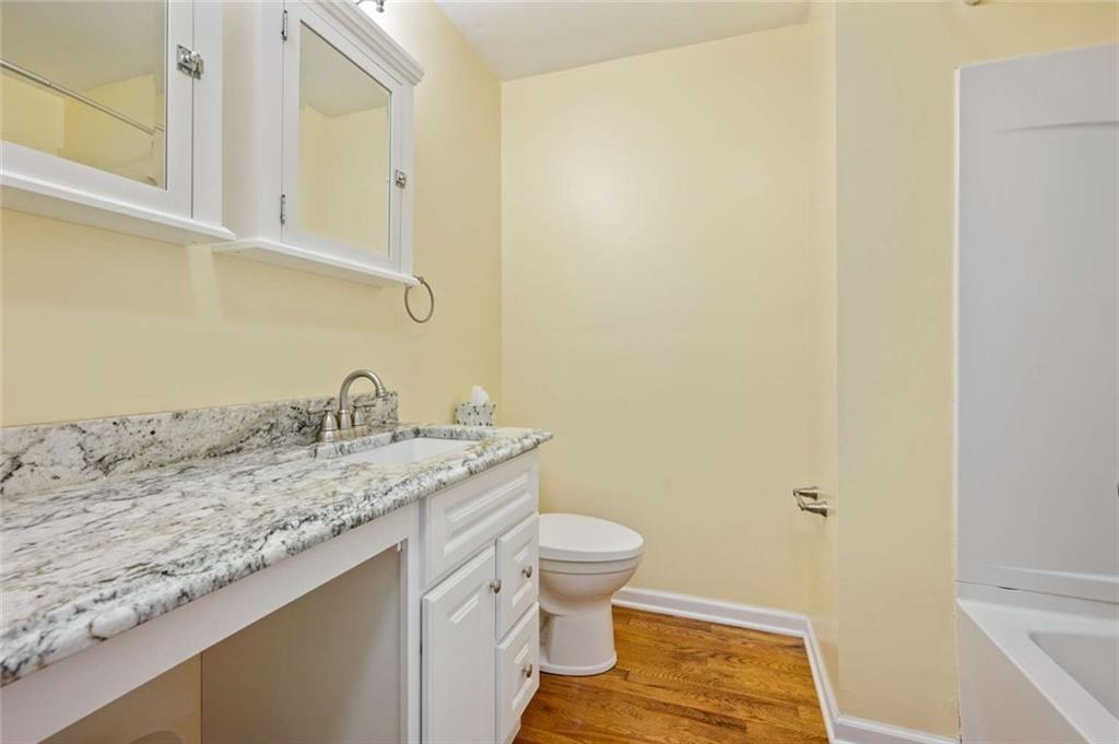 9767 Bellcrest Road Pittsburgh, PA 15237 - Photo 7 of 25 a bathroom with a granite countertop sink and a toilet