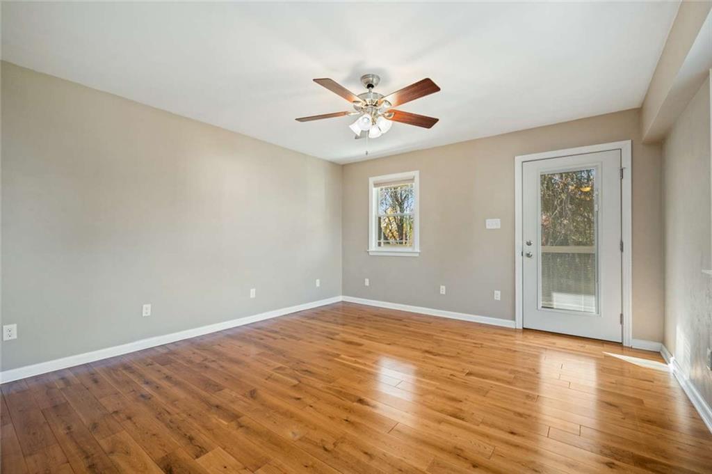 9767 Bellcrest Road Pittsburgh, PA 15237 - Photo 9 of 25 wooden floor in an empty room with a window