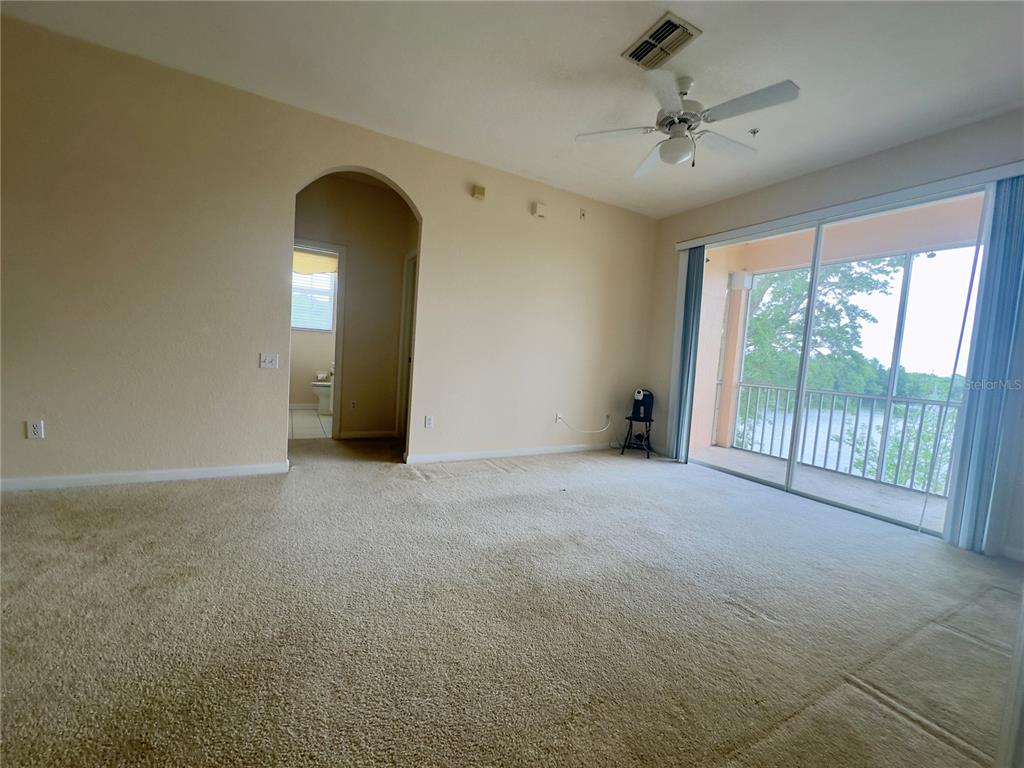 13536 Turtle Marsh Loop, Unit 532 Orlando, FL 32837 - Photo 12 of 26 a view of an empty room with a window