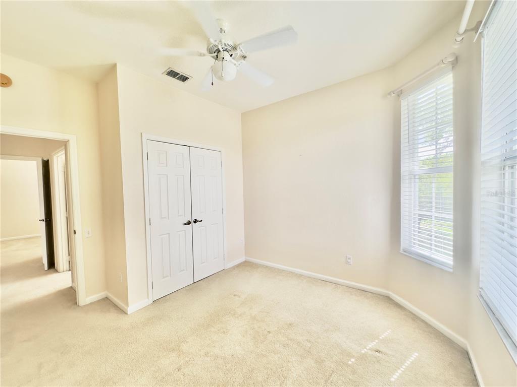 13536 Turtle Marsh Loop, Unit 532 Orlando, FL 32837 - Photo 18 of 26 a view of an empty room with a window