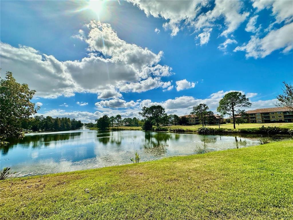 13536 Turtle Marsh Loop, Unit 532 Orlando, FL 32837 - Photo 2 of 26 a view of a lake with outdoor space