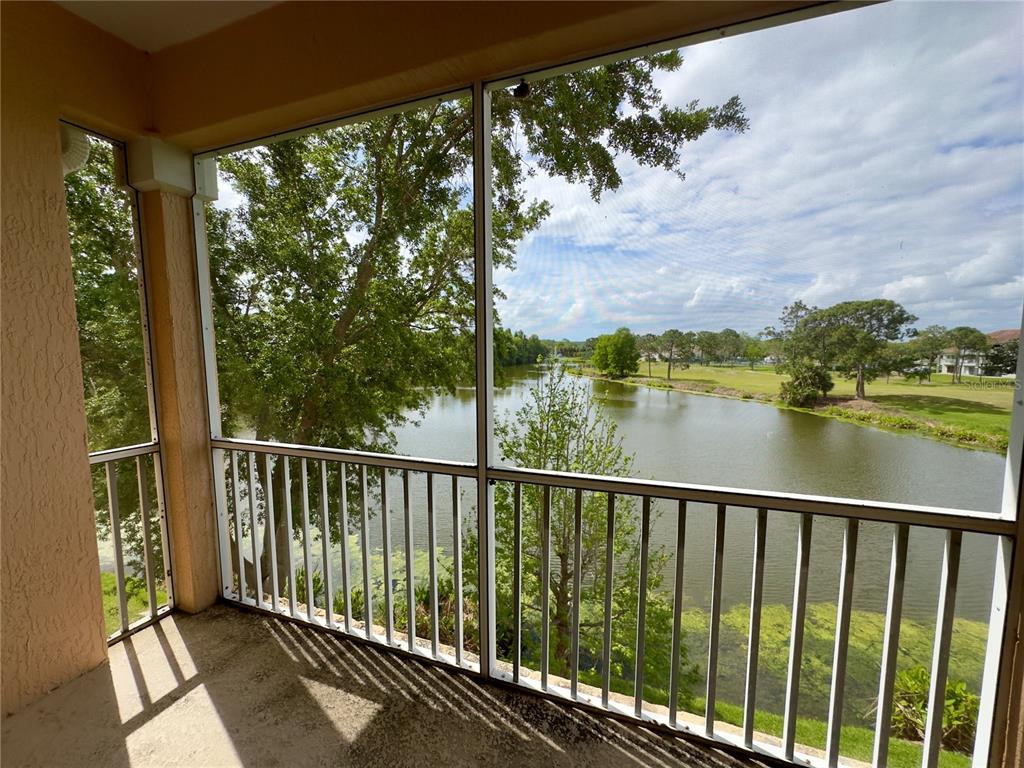 13536 Turtle Marsh Loop, Unit 532 Orlando, FL 32837 - Photo 24 of 26 a view of a balcony with lake view