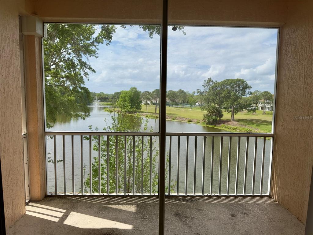 13536 Turtle Marsh Loop, Unit 532 Orlando, FL 32837 - Photo 25 of 26 a view of a glass door with a view of a balcony