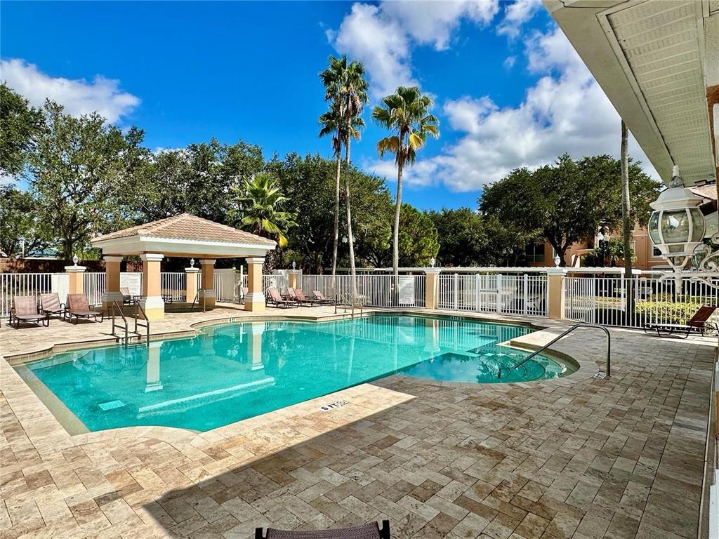 13536 Turtle Marsh Loop, Unit 532 Orlando, FL 32837 - Photo 3 of 26 a view of a house with a yard patio and swimming pool