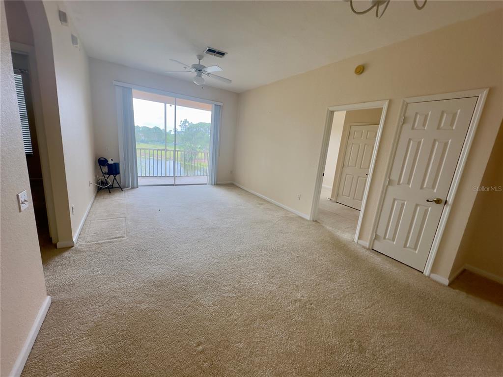 13536 Turtle Marsh Loop, Unit 532 Orlando, FL 32837 - Photo 10 of 26 an empty room with windows