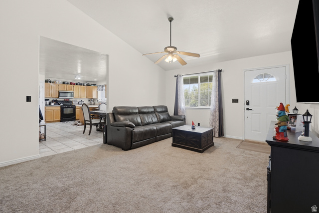 2135 East White Pine Road Eagle Mountain, UT 84005 - Photo 4 of 23 Carpeted living area featuring a vaulted ceiling with a ceiling fan