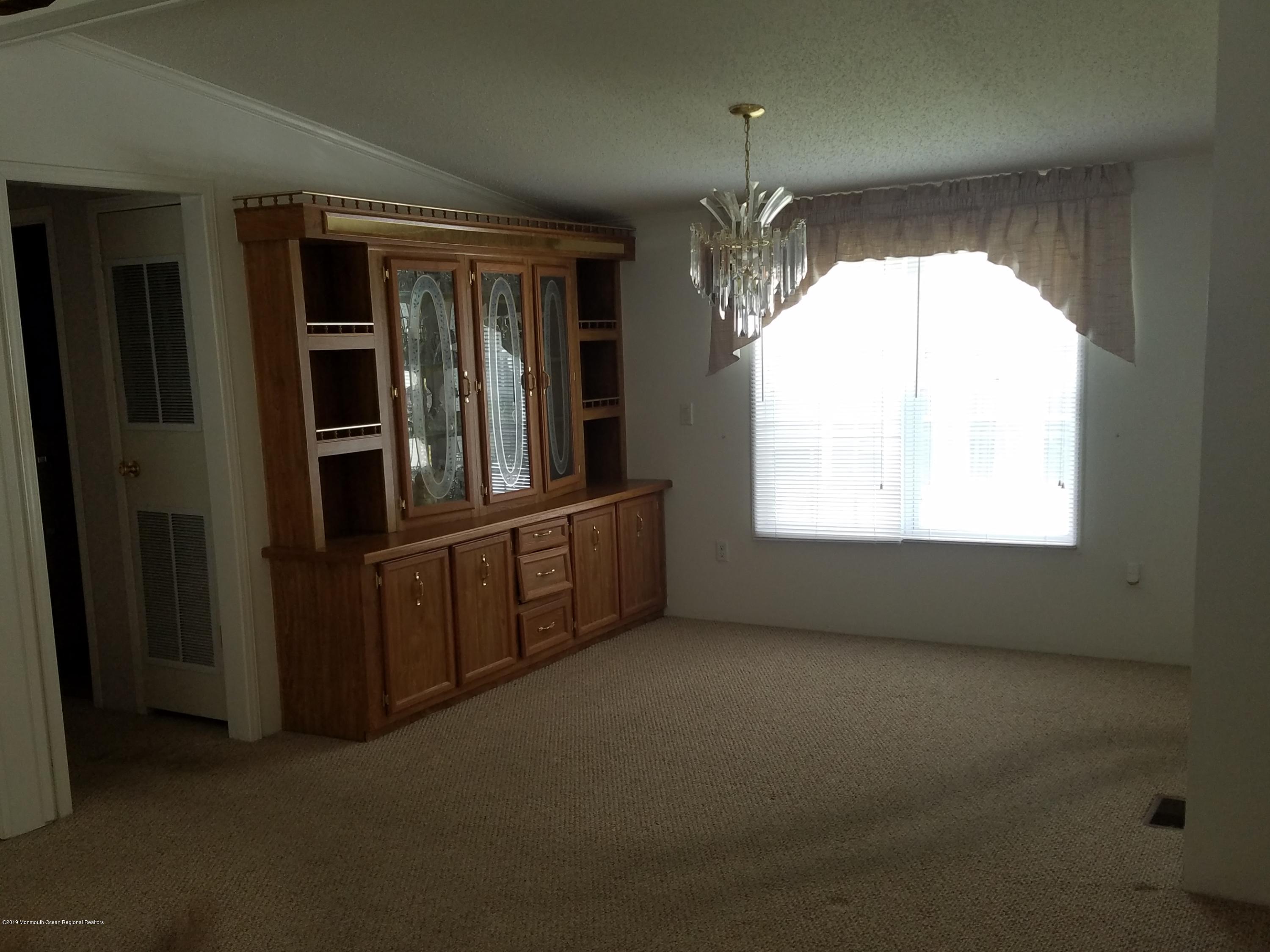 15 Village Road Morganville, NJ 07751 - Photo 6 of 12 a view of empty room with window