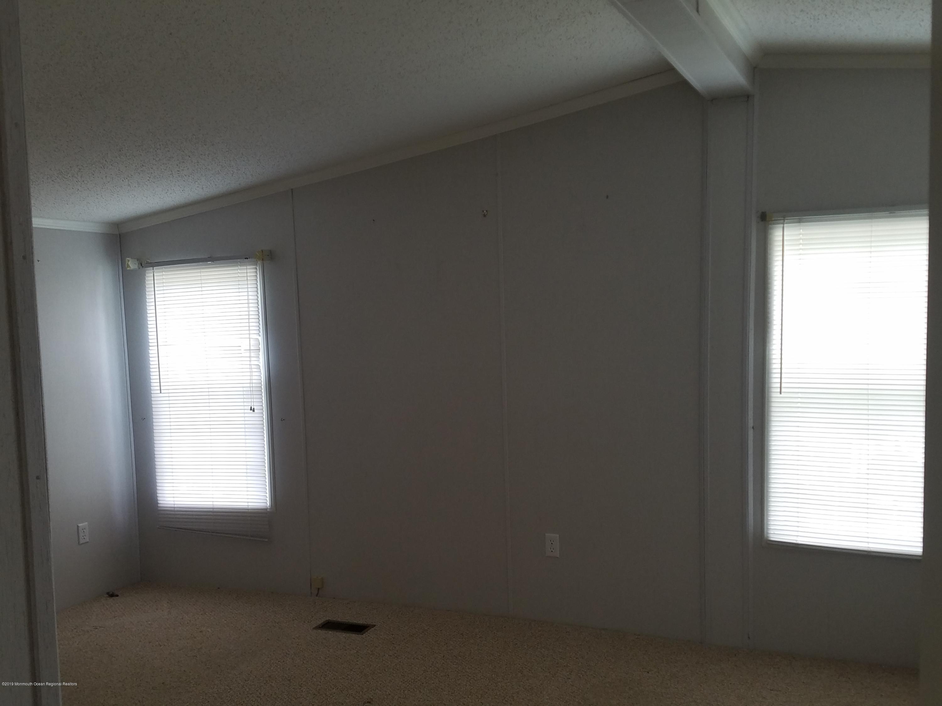 15 Village Road Morganville, NJ 07751 - Photo 7 of 12 a small space with windows and closet