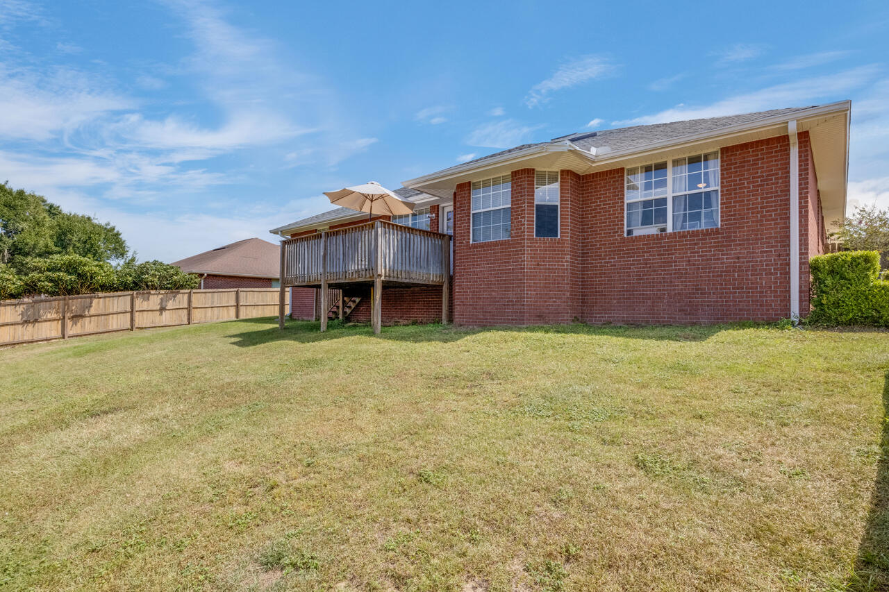 419 Triton Street Crestview, FL 32536 - Photo 50 of 60 a view of a house with a backyard