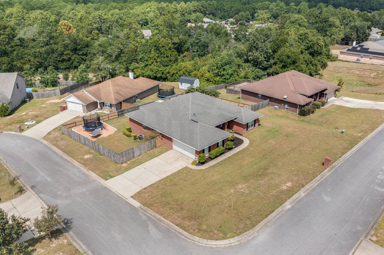 419 Triton Street Crestview, FL 32536 - Photo 56 of 60 an aerial view of residential houses with outdoor space
