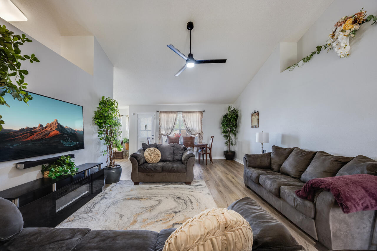 419 Triton Street Crestview, FL 32536 - Photo 9 of 60 a living room with furniture and a flat screen tv