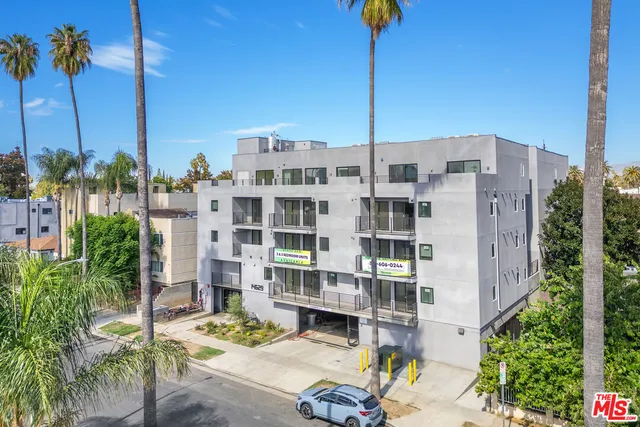a front view of a building with outdoor seating