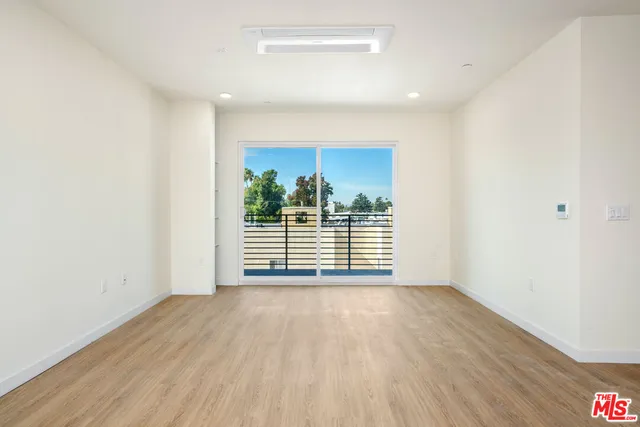 a kitchen with stainless steel appliances a refrigerator sink and stove