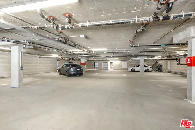 a view of parking garage with cars