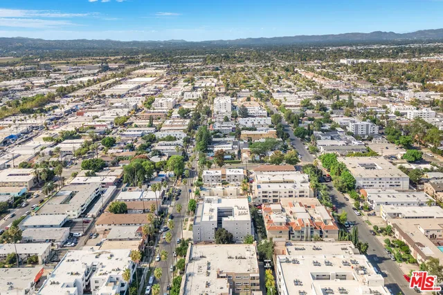 an aerial view of residential building with lake view