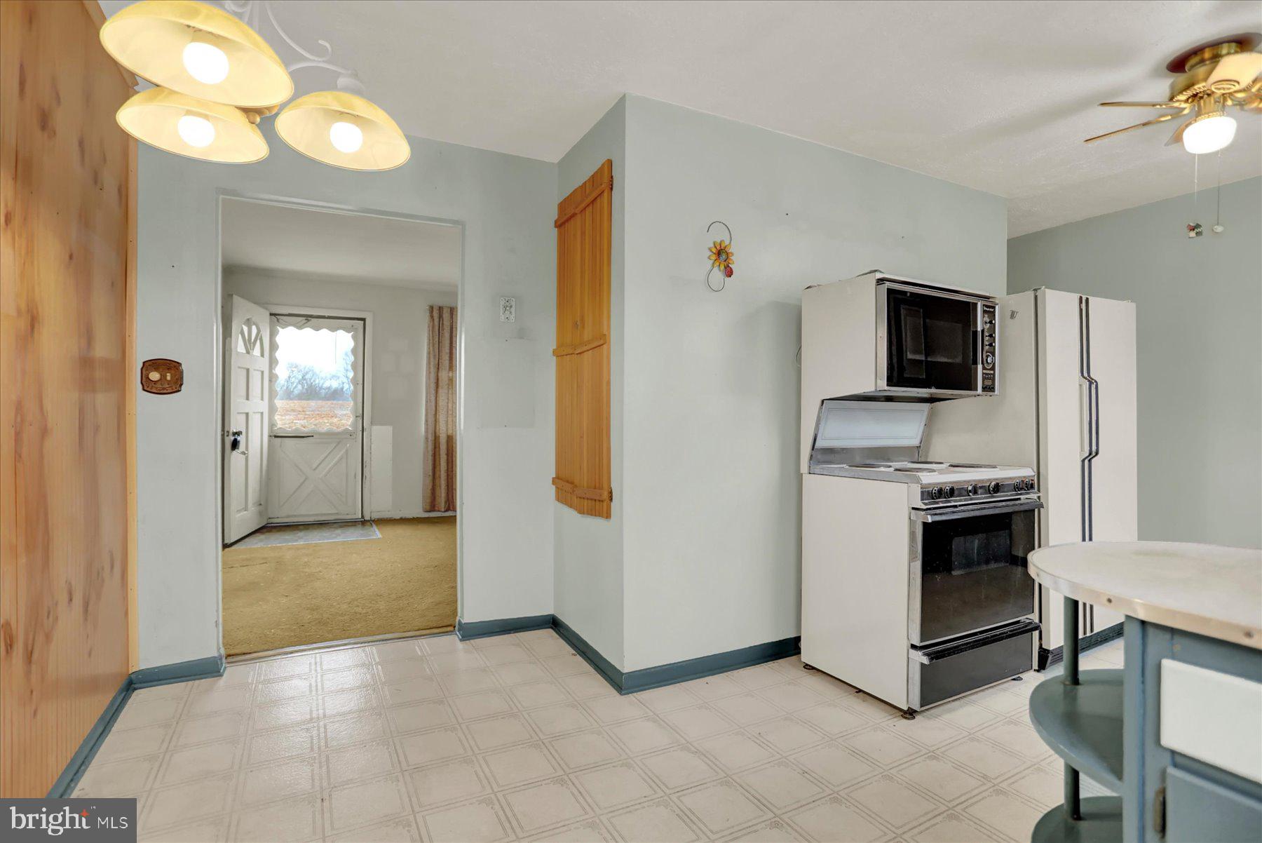 2115 White House Road Bel Air, MD 21015 - Photo 5 of 30 a view of kitchen with stainless steel appliances granite countertop cabinets and fireplace