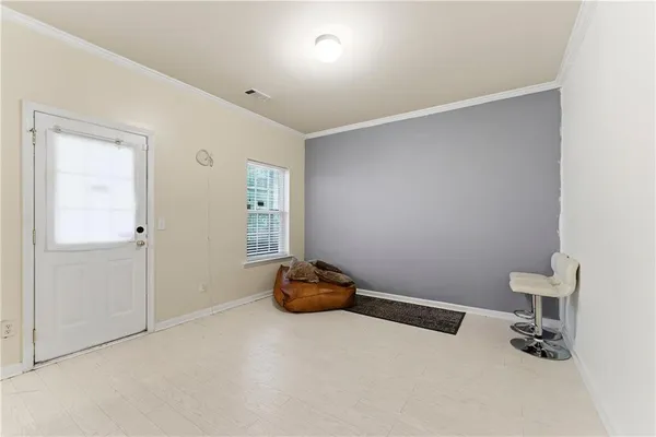 a room with gym equipment and a window