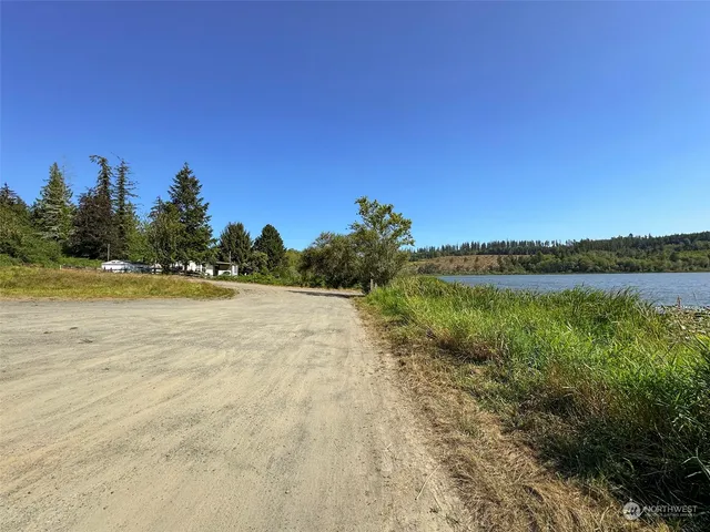 a view of lake with houses in the back