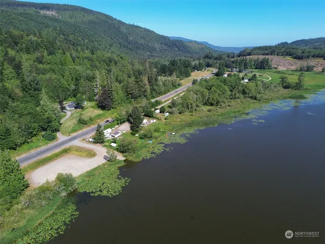 a view of a house with a yard and a garden