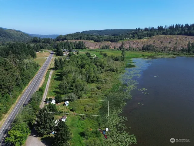 a view of a garden with an outdoor seating