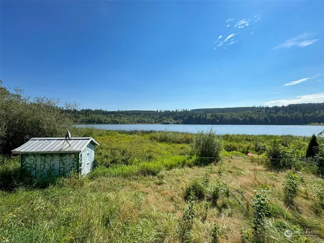 a view of a lake with houses in the back