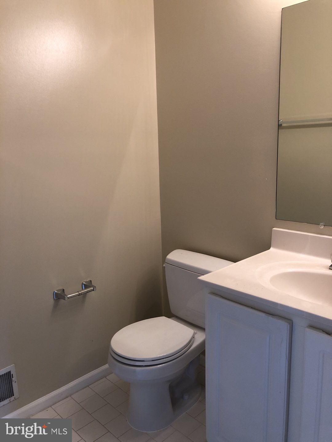 6134 Quiet Times Columbia, MD 21045 - Photo 14 of 17 a white toilet sitting next to a shower