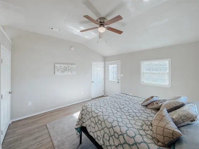 a bedroom with a bed and window