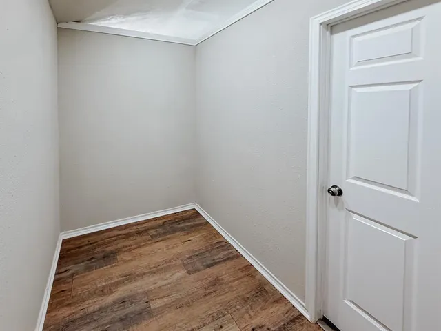 a view of small space with wooden floor