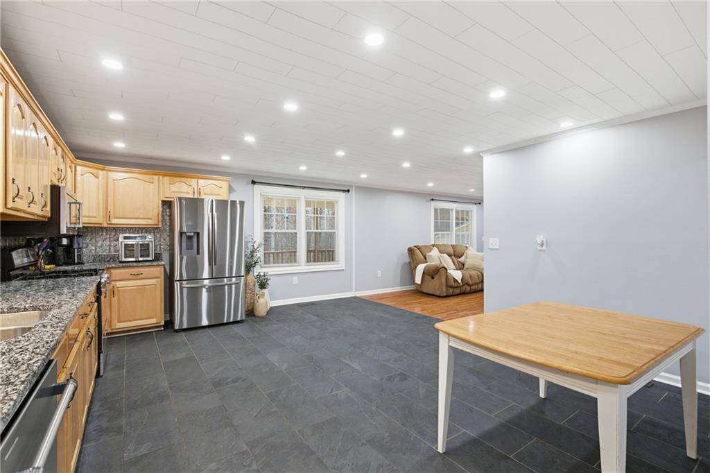 51 Perry Lane Buchanan, GA 30113 - Photo 14 of 33 a view of a kitchen with refrigerator and workspace