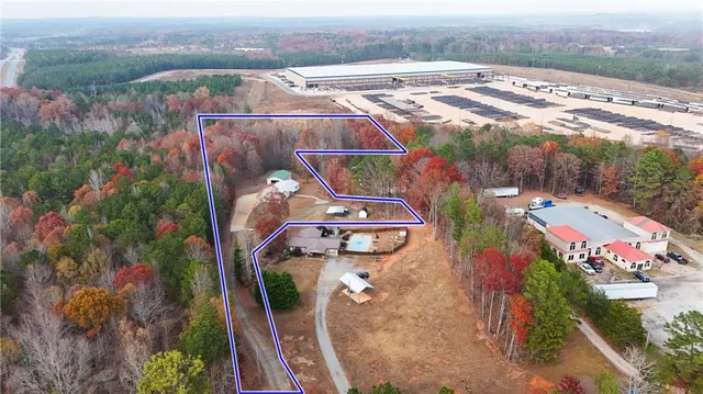 an aerial view of a house with outdoor space