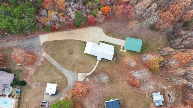 an aerial view of a house with outdoor space