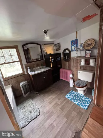 a bedroom with bed and window