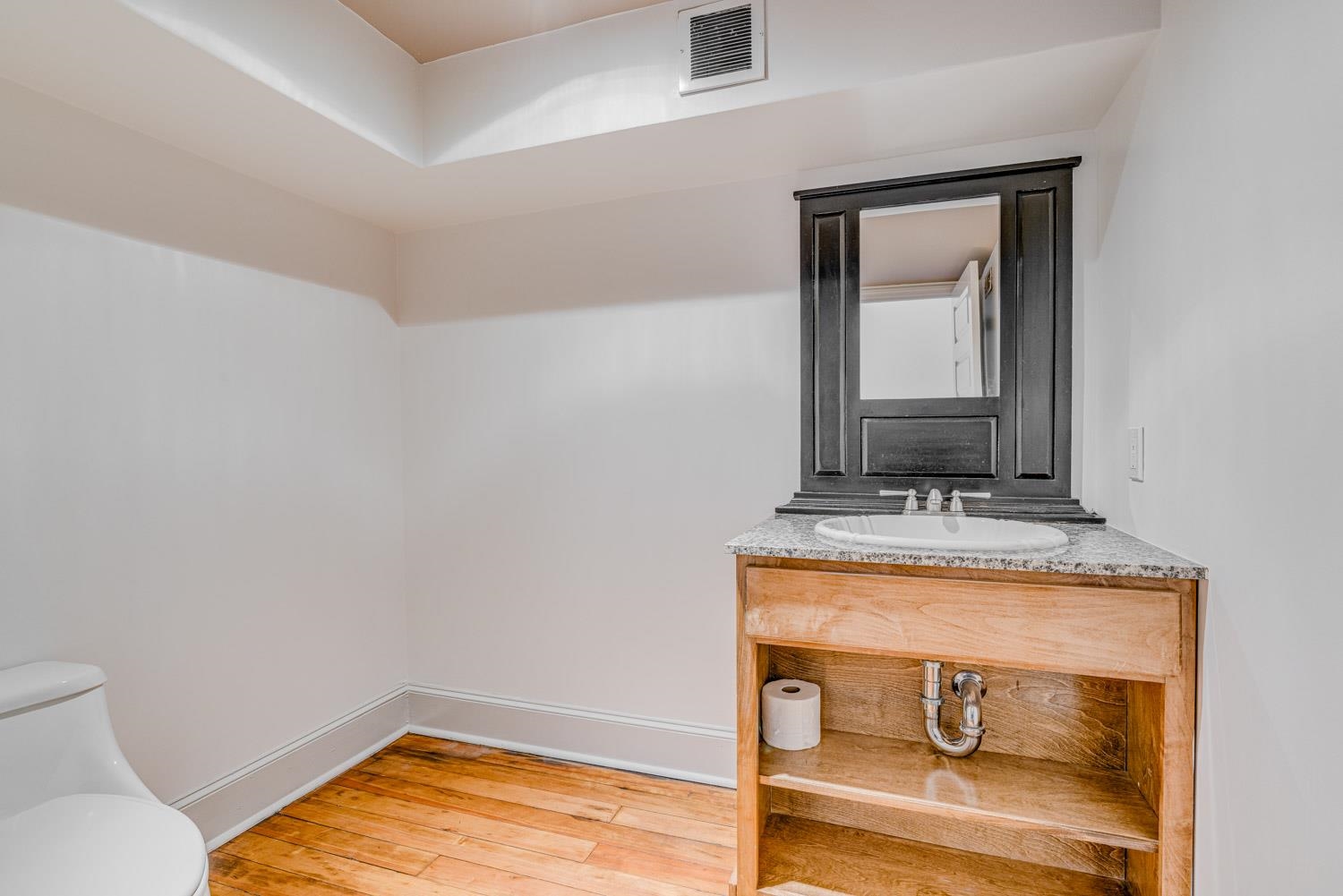 310 South Main Street, Unit 101 Memphis, TN 38103 - Photo 14 of 29 a room with a table and mirror
