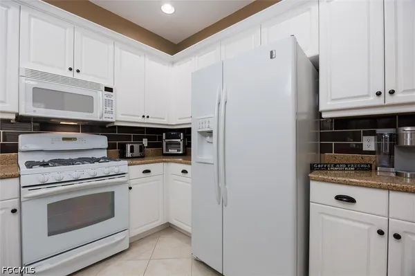 a bathroom with a sink a toilet and a window
