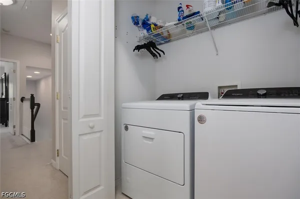 an aerial view of residential houses with outdoor space and swimming pool