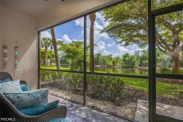 a view of a garden with a bench in the background