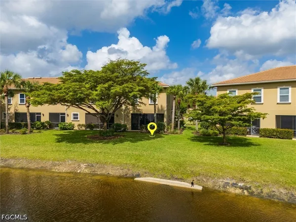 a view of a swimming pool and lounge chair