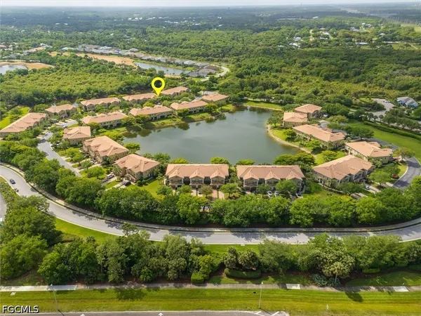 an aerial view of a house with a ocean view