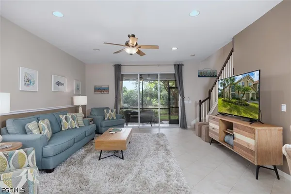 a living room with furniture and a large window