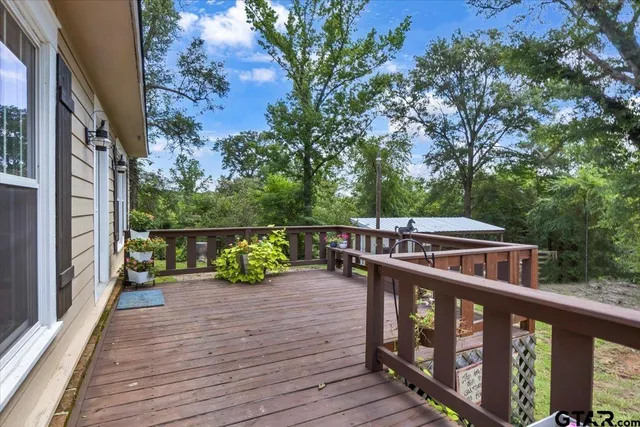 a view of balcony with deck and wooden floor