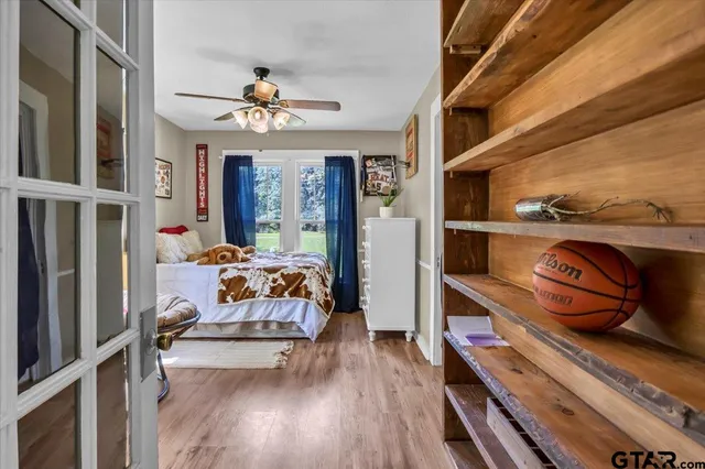 a bedroom with furniture and a chandelier
