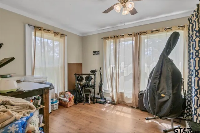 a view of a livingroom with lounge chair and a window