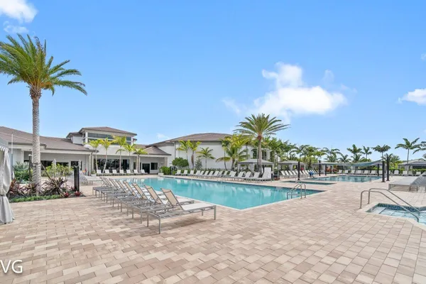 a view of swimming pool with outdoor seating
