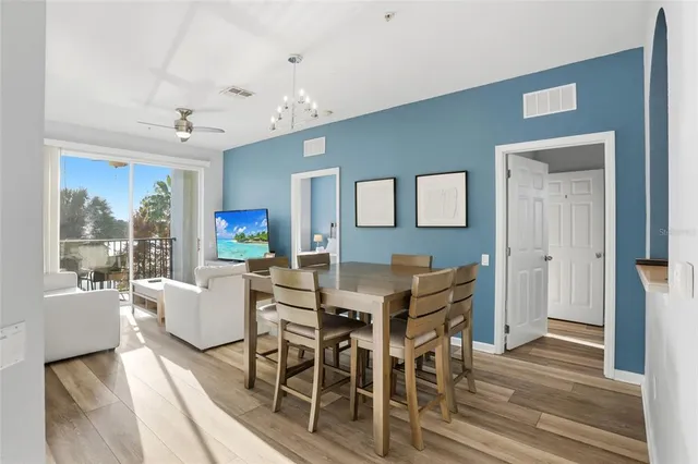 a view of a dining room with furniture and wooden floor