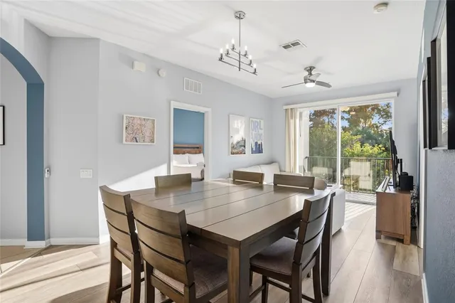 a view of a dining room with furniture window and outside view